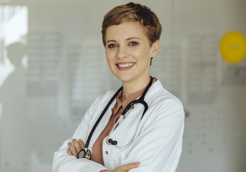 stock-photo-image-of-young-beautiful-joyful-woman-smiling-while-working-with-laptop-in-office-1786572482